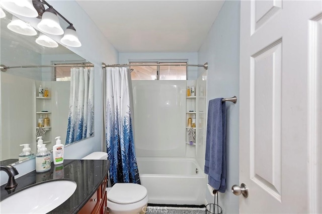 bathroom featuring vanity, toilet, and shower / tub combo