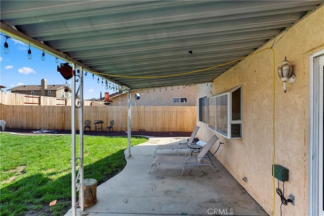 view of patio / terrace featuring fence