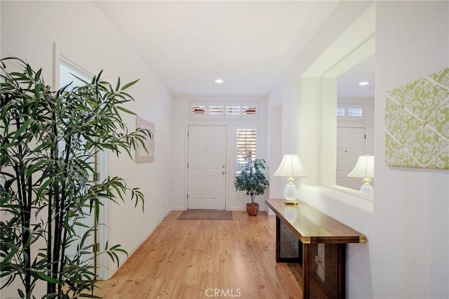 entryway featuring recessed lighting, baseboards, and light wood finished floors