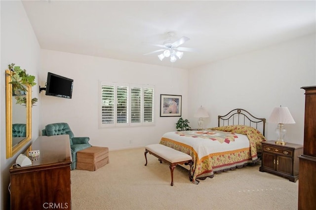 bedroom featuring a ceiling fan and light carpet