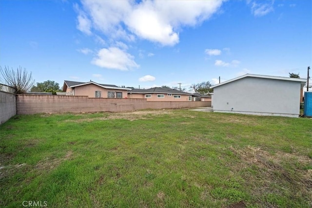 view of yard featuring a fenced backyard