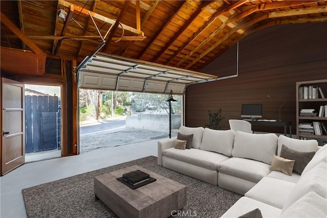 garage featuring wooden ceiling and wood walls