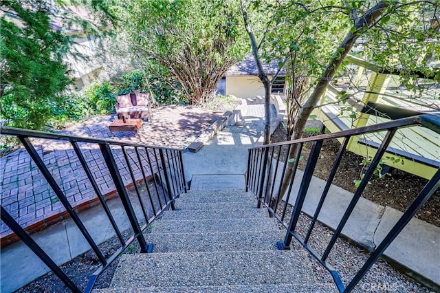 view of home's community with a patio area