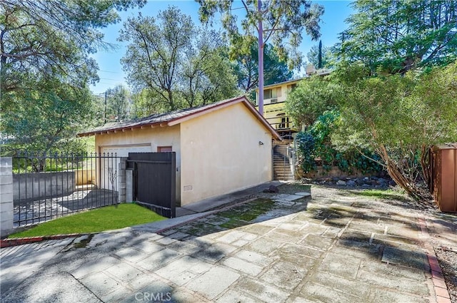 view of outbuilding with an outbuilding and fence