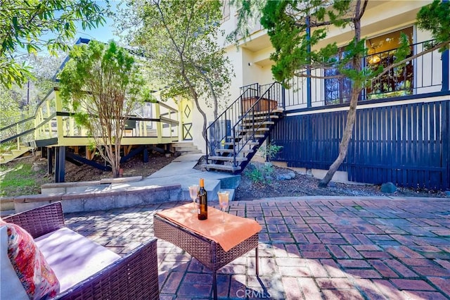 view of patio featuring stairway