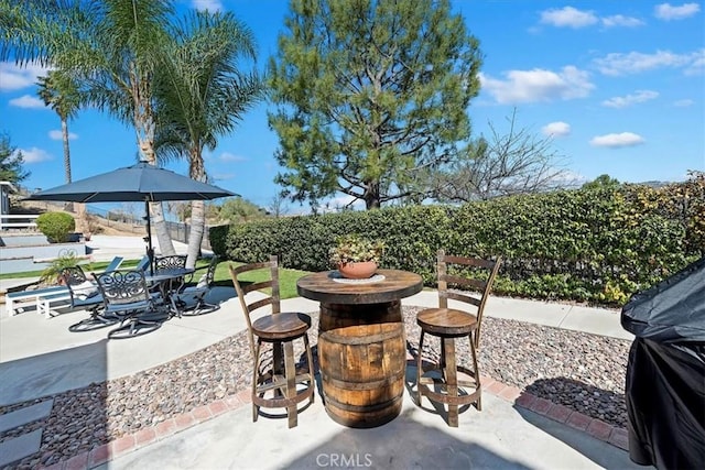 view of patio / terrace with fence