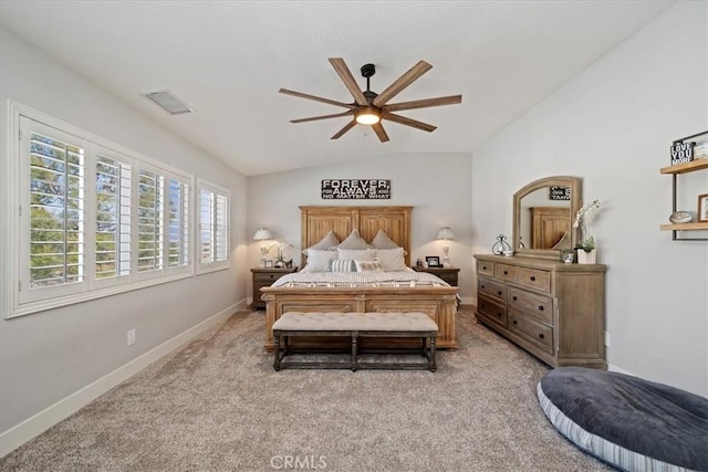 bedroom featuring lofted ceiling, light colored carpet, a ceiling fan, baseboards, and visible vents