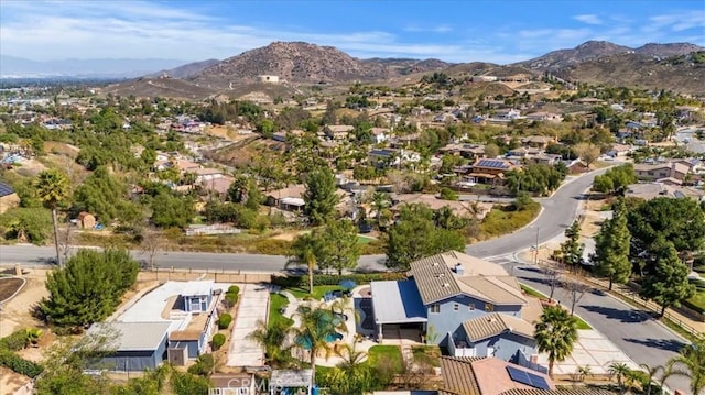 drone / aerial view with a residential view and a mountain view