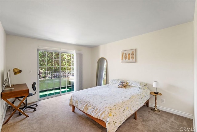 bedroom with carpet floors, access to outside, and baseboards