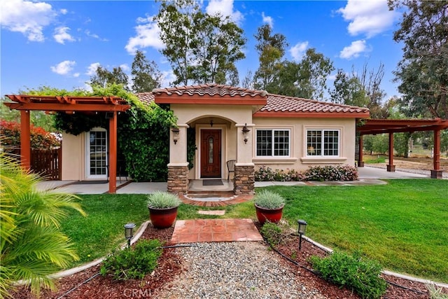 mediterranean / spanish-style house featuring a front yard, a tiled roof, and stucco siding