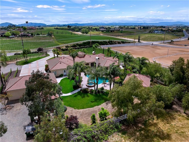 drone / aerial view featuring a mountain view and a rural view