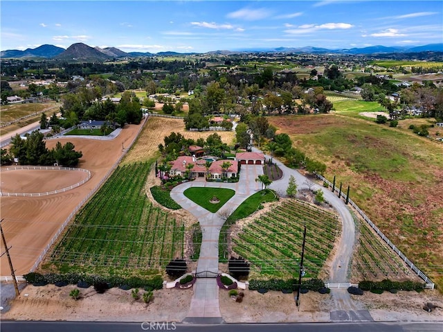 aerial view featuring a rural view and a mountain view