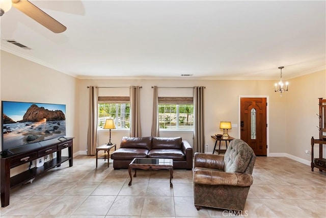 living room with visible vents, baseboards, ornamental molding, and light tile patterned flooring