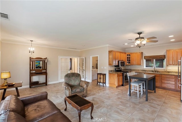 living room featuring visible vents, crown molding, baseboards, recessed lighting, and ceiling fan with notable chandelier