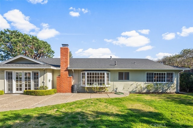 2851 Catalpa St, Newport Beach, CA 92660 - back of property featuring french doors, a lawn, a chimney, and stucco siding