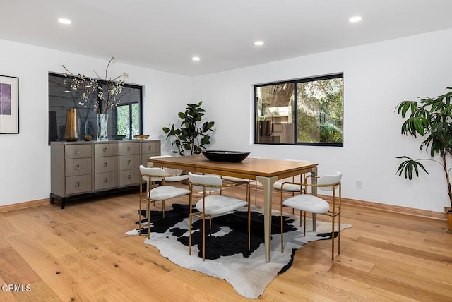 dining room with baseboards, recessed lighting, and light wood-style floors