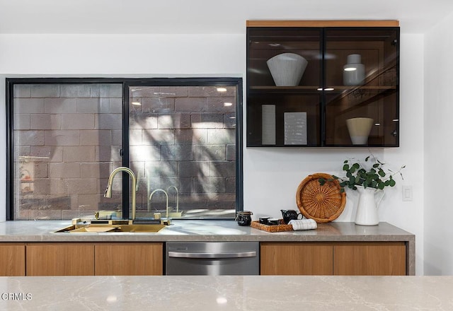 bar featuring tasteful backsplash, a sink, and stainless steel dishwasher