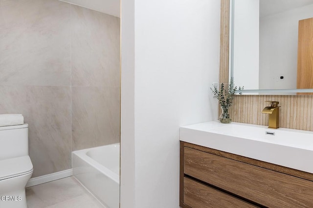 bathroom featuring tile patterned flooring, vanity, and toilet