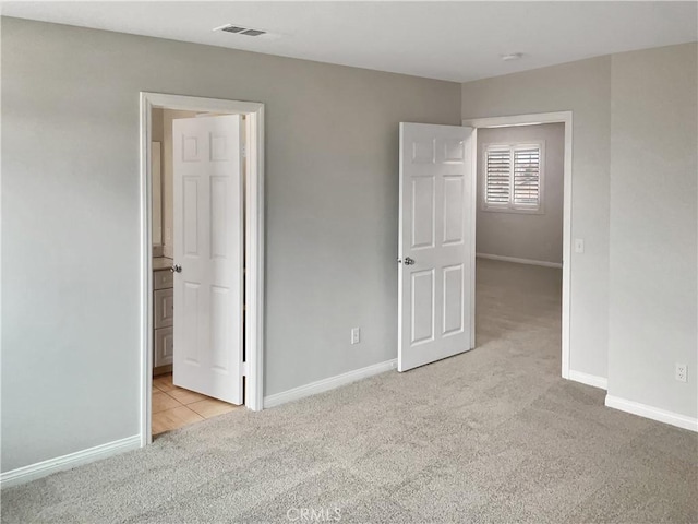 3434 Presidio Ln, Perris, CA 92570 - unfurnished bedroom featuring baseboards, visible vents, and carpet flooring