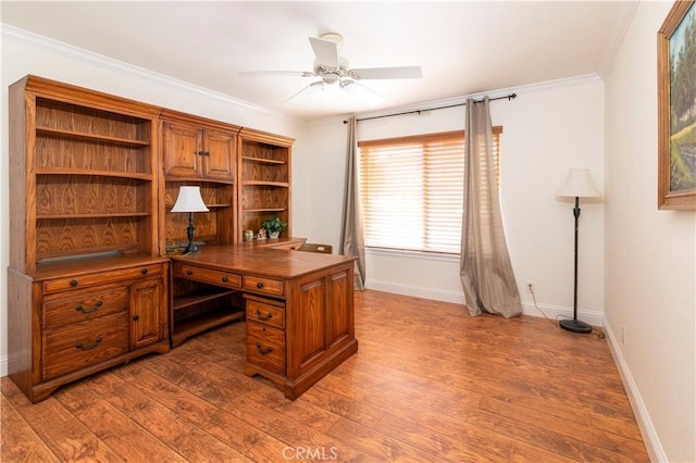 office area featuring a ceiling fan, baseboards, ornamental molding, and dark wood-type flooring