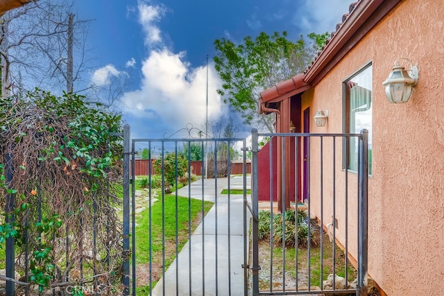 view of gate with fence