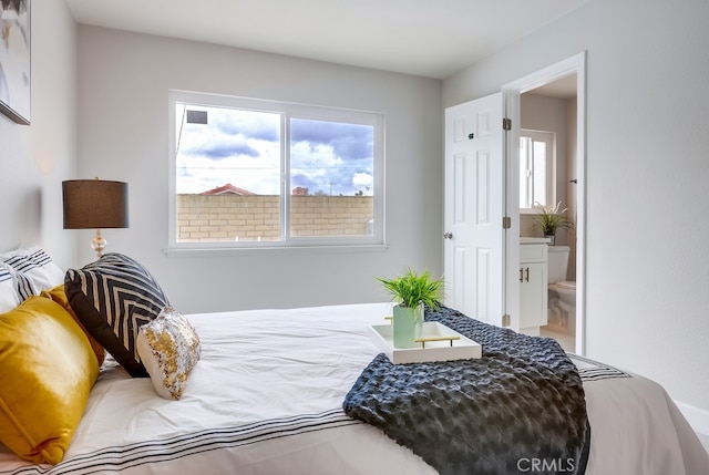 bedroom featuring ensuite bath