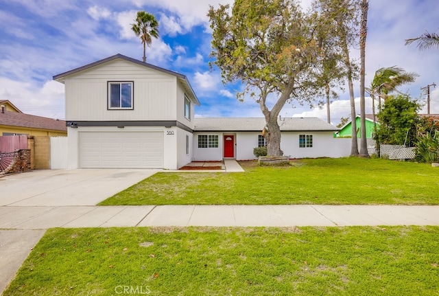 view of front facade featuring a front yard, concrete driveway, fence, and an attached garage