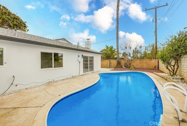 view of pool featuring a fenced in pool, a patio area, and a fenced backyard