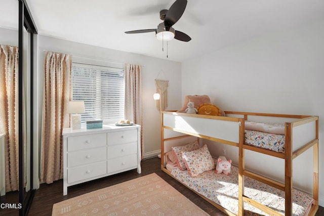 bedroom featuring dark wood-type flooring and ceiling fan