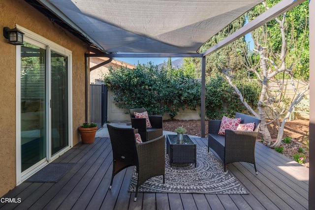 deck with outdoor lounge area and fence