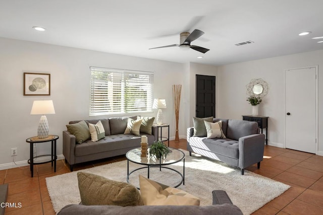 living room featuring tile patterned flooring, visible vents, a ceiling fan, and recessed lighting