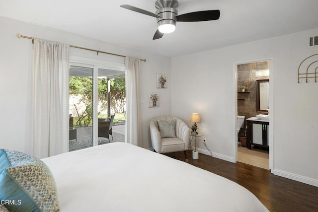 bedroom with access to exterior, ceiling fan, ensuite bath, wood finished floors, and baseboards