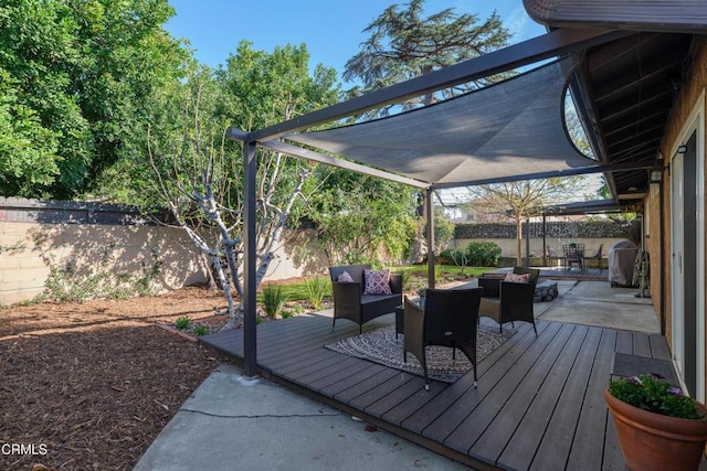 deck with a patio and a fenced backyard