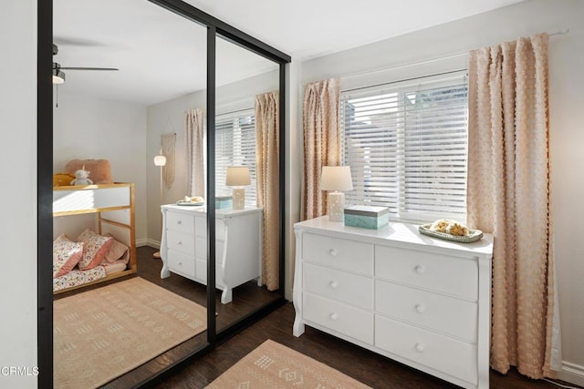 bedroom with dark wood finished floors