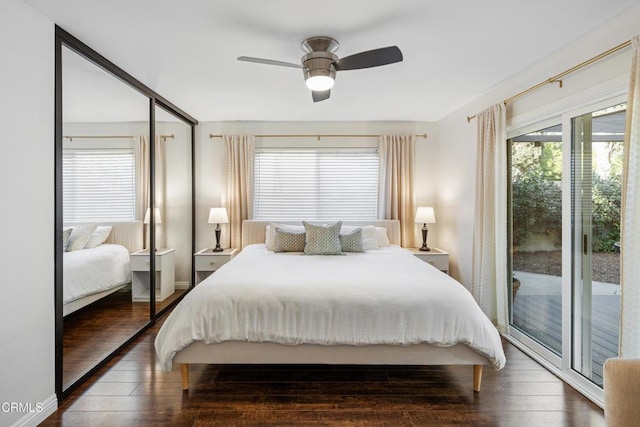 bedroom featuring ceiling fan, access to outside, hardwood / wood-style floors, and baseboards