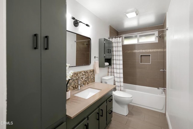 full bathroom featuring tile patterned flooring, toilet, vanity, decorative backsplash, and shower / bath combination with curtain