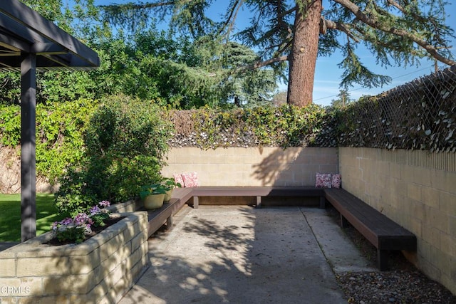 view of patio / terrace featuring fence