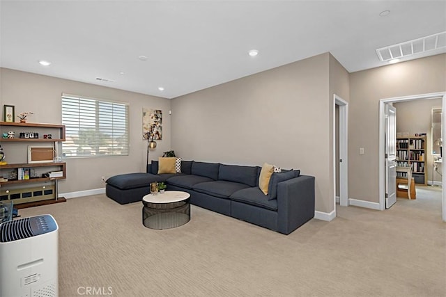 living area with recessed lighting, light carpet, visible vents, and baseboards