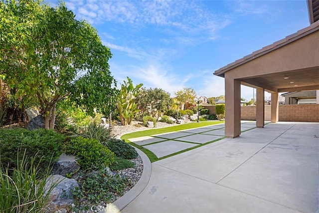 exterior space with fence and a patio