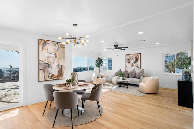 dining area featuring recessed lighting, an inviting chandelier, light wood-style flooring, and baseboards