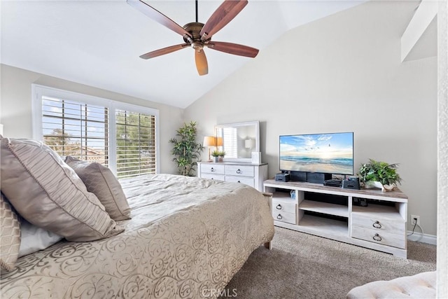 bedroom with ceiling fan, carpet floors, and high vaulted ceiling