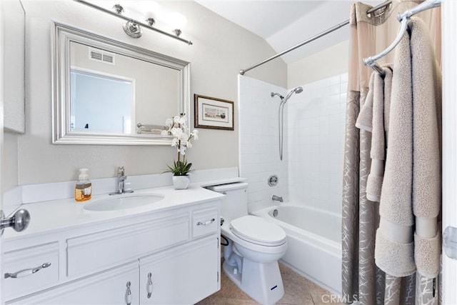 full bath with visible vents, toilet, shower / bath combo with shower curtain, vanity, and tile patterned floors