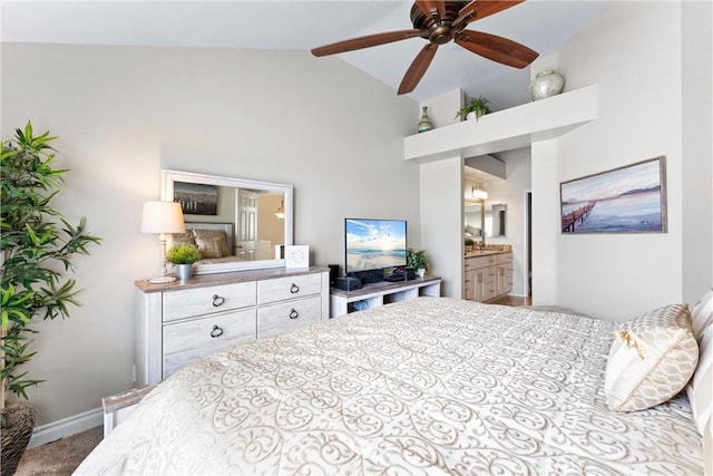 bedroom featuring high vaulted ceiling, carpet flooring, connected bathroom, and baseboards