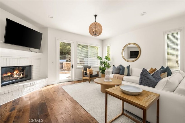 living area with a fireplace and hardwood / wood-style floors