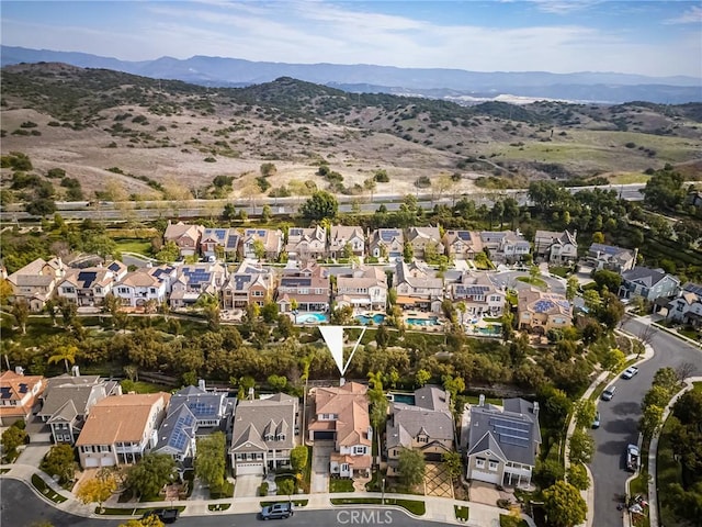 aerial view featuring a mountain view and a residential view