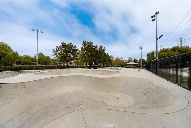 view of property's community with a patio area and fence