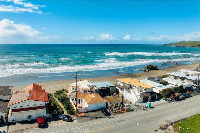 bird's eye view featuring a beach view and a water view