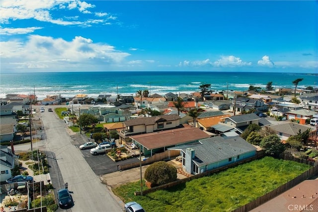 birds eye view of property with a water view and a residential view