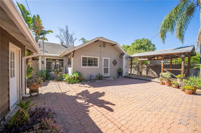 exterior space with a gazebo and fence