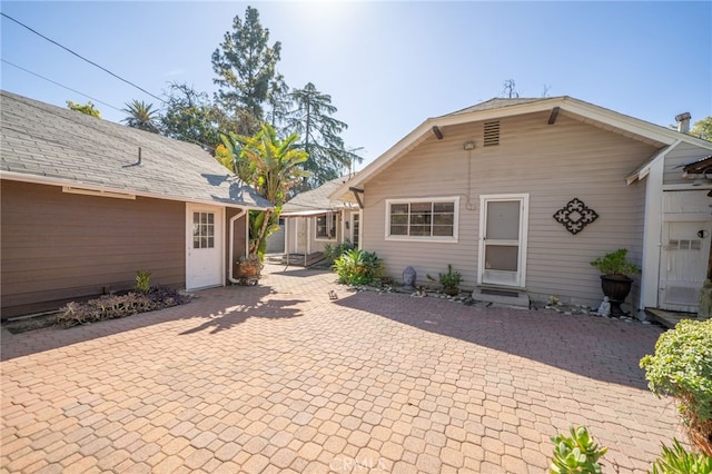 rear view of property with a patio area